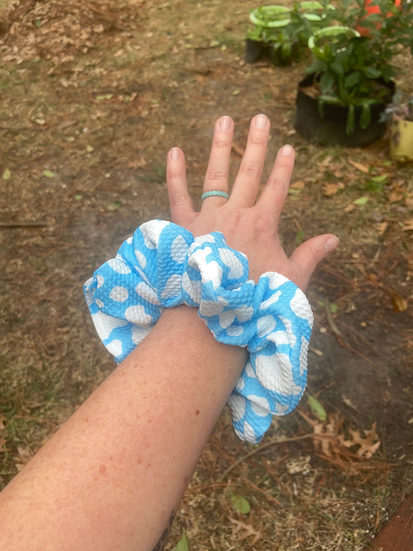 blue cow scrunchie on arm