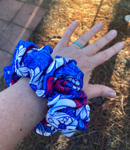 red, white, and blue floral scrunchies on wrist