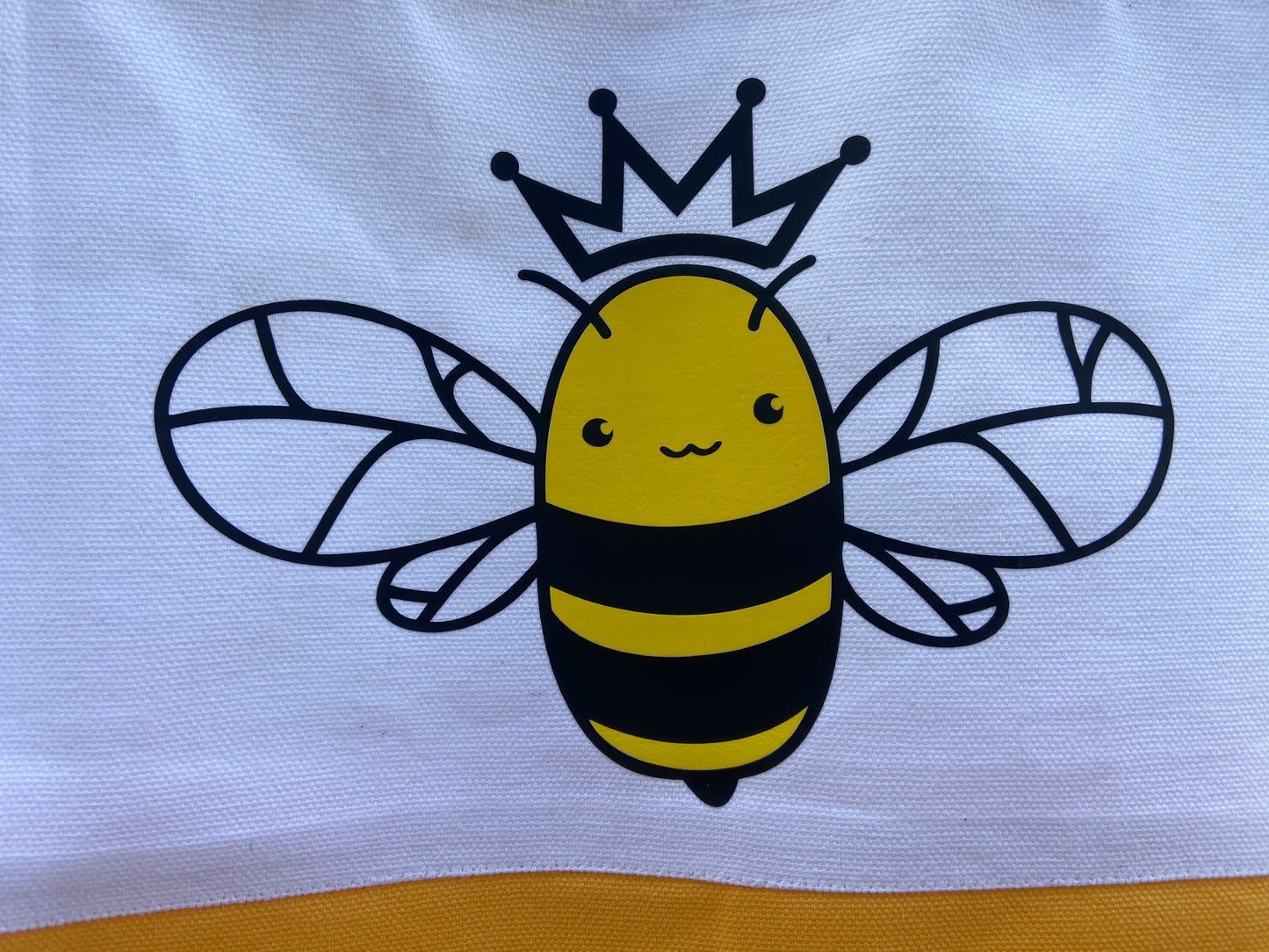 Honey bee wearing a crown iron on