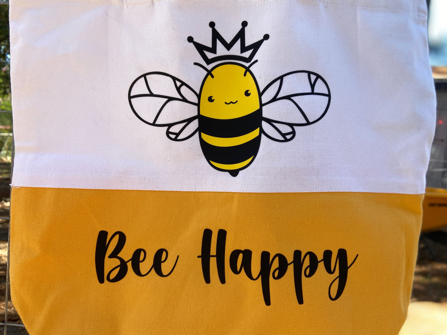 White and Yellow Honeybee wearing a crown tote bag